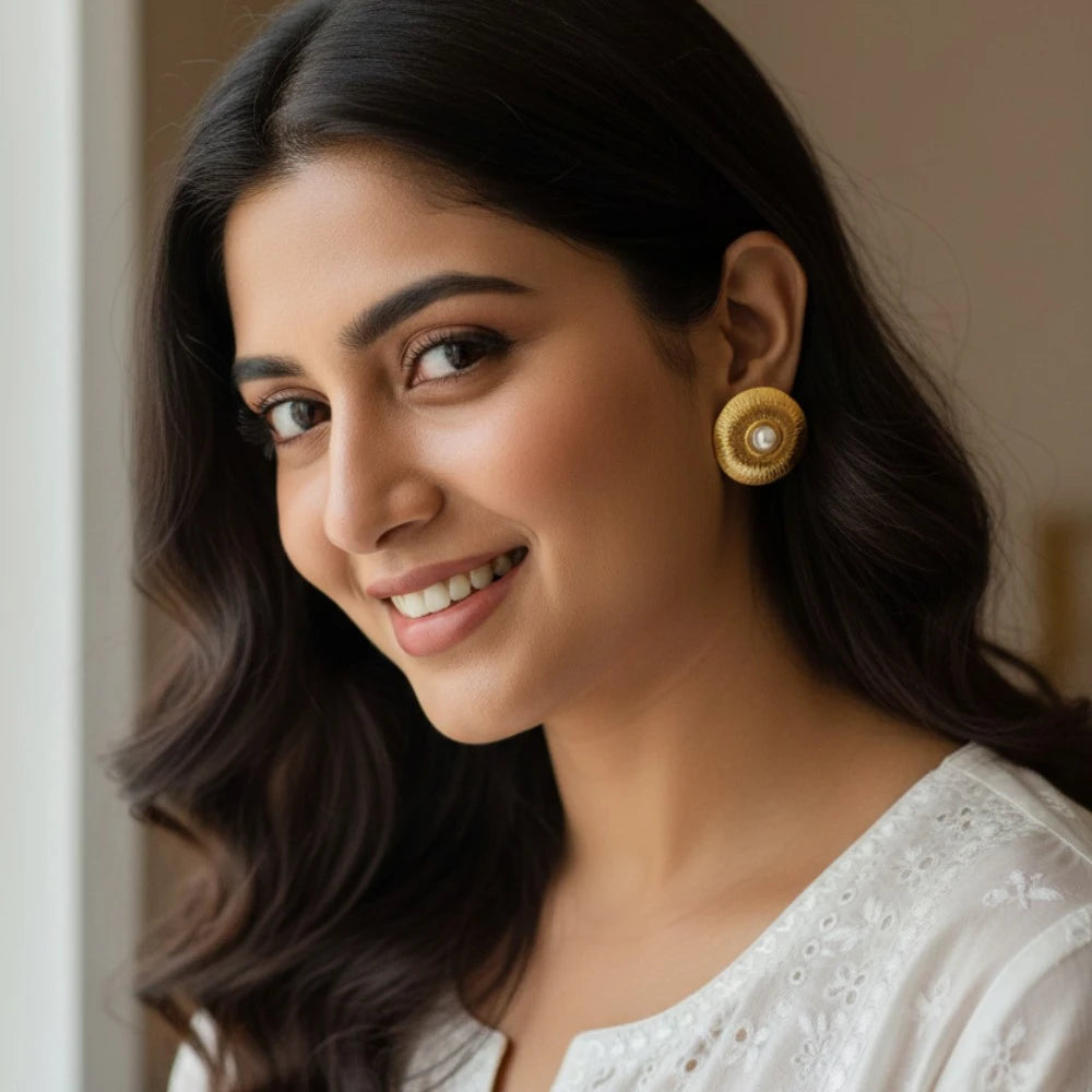 Elara gold stud earrings styled with Indian ethnic outfit