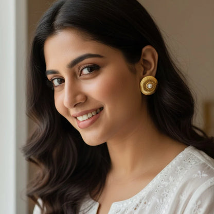 Elara gold stud earrings styled with Indian ethnic outfit