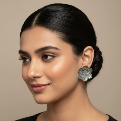 Noor floral oxidized silver stud earrings antique finish model photo