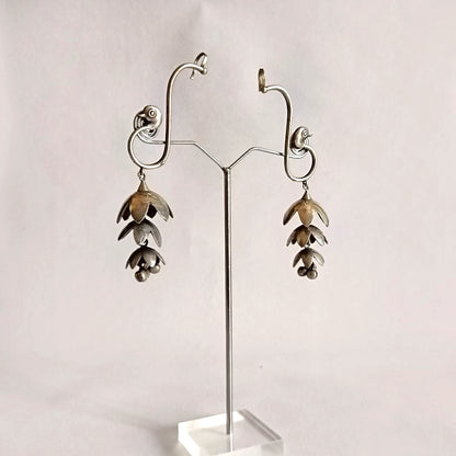 Mayurika silver peacock earcuff with 3-layer jhumka and ghunghroo detailing