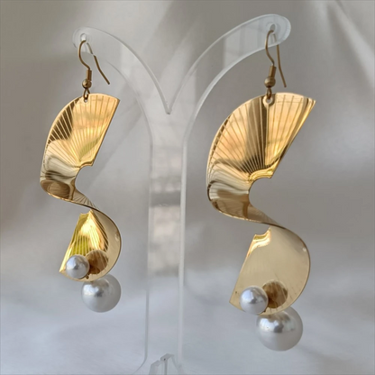 Veyra gold sculptural wave earrings with pearl accents